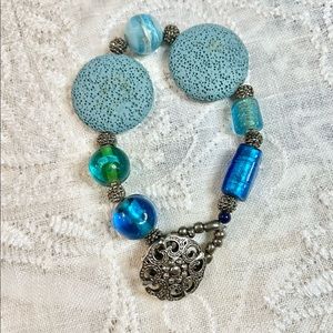 Boho bracelet in beachy blue colors. Lava, glass, acrylic.